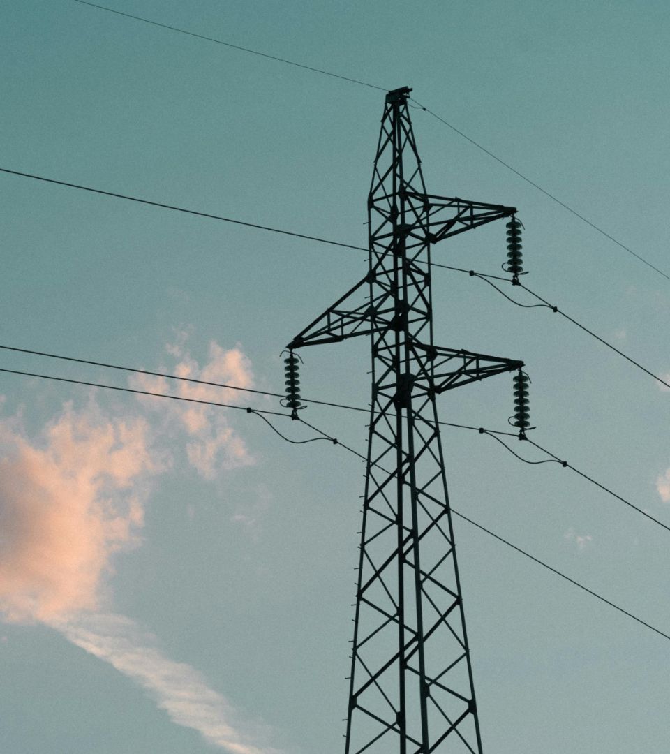 High-voltage pylon against the evening sky